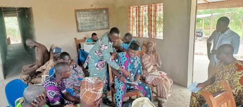 Board members in a practical session during their training course